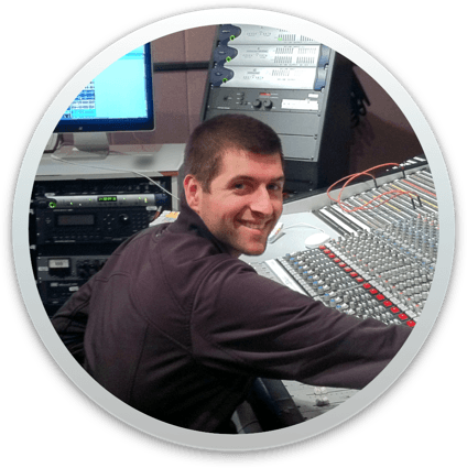 John sitting at recording console